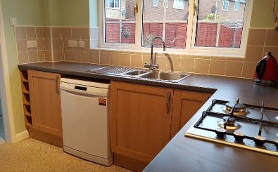 Tiling, fitting of units, dishwasher,sink and hob.
